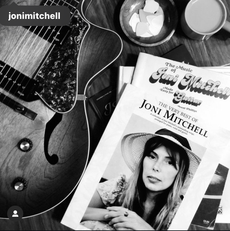 My Joni Mitchell songbooks and guitar on the music room table